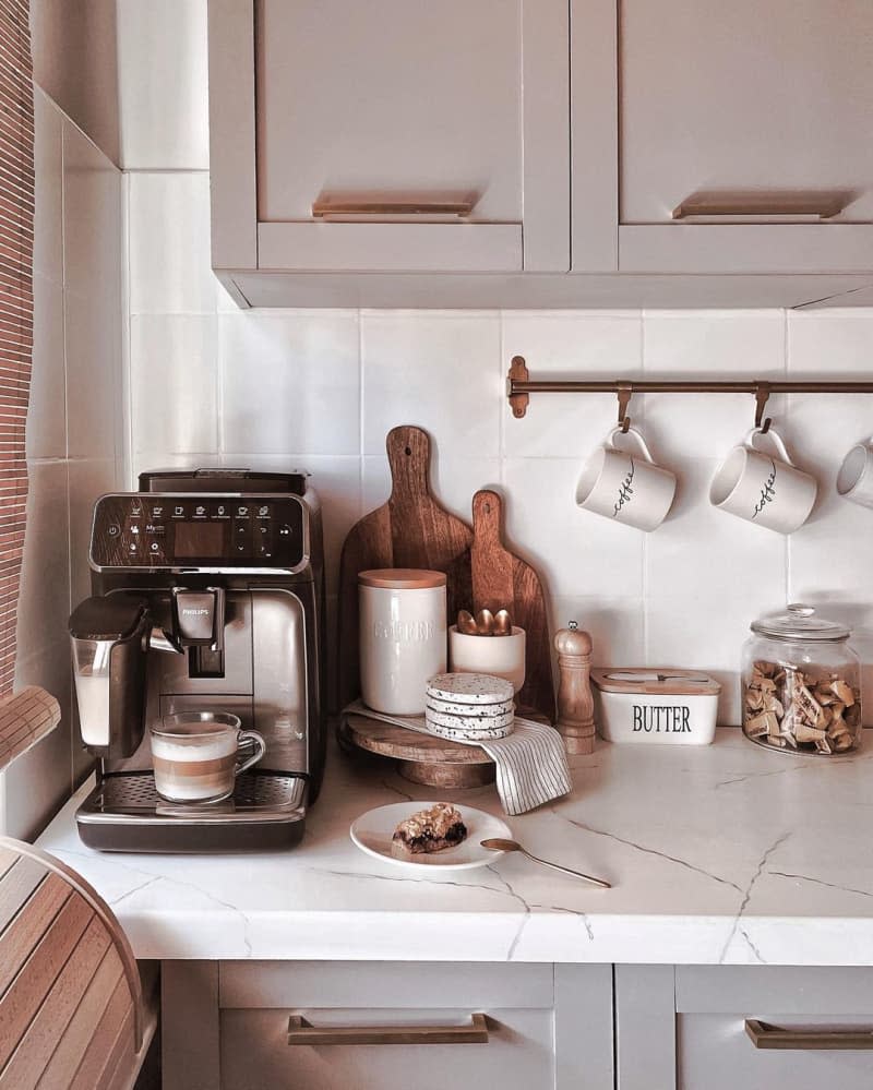 Corner of a white countertop with coffee station