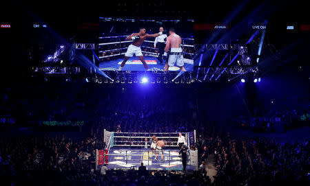 Boxing - Anthony Joshua vs Joseph Parker - World Heavyweight Title Unification Fight - Principality Stadium, Cardiff, Britain - March 31, 2018 General view of Anthony Joshua in action with Joseph Parker Action Images via Reuters/Lee Smith