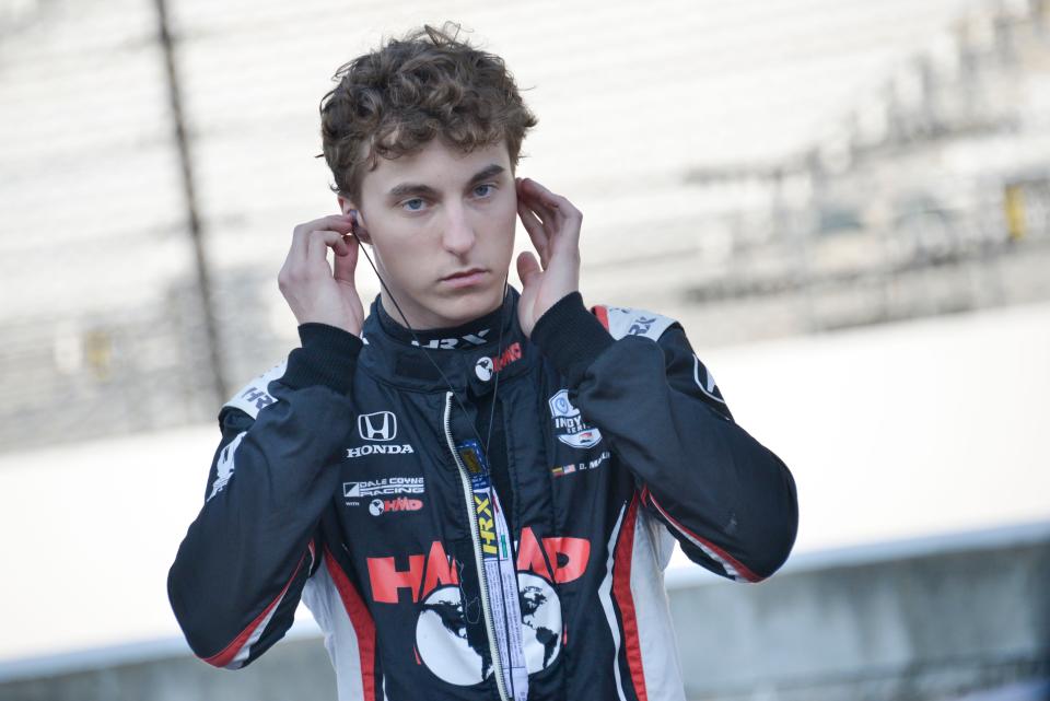 Dale Coyne Racing with HMD Motorsports driver David Malukas (18) puts in his hearing protection Friday, Aug. 11, 2023, during practice for the Gallagher Grand Prix at Indianapolis Motor Speedway.