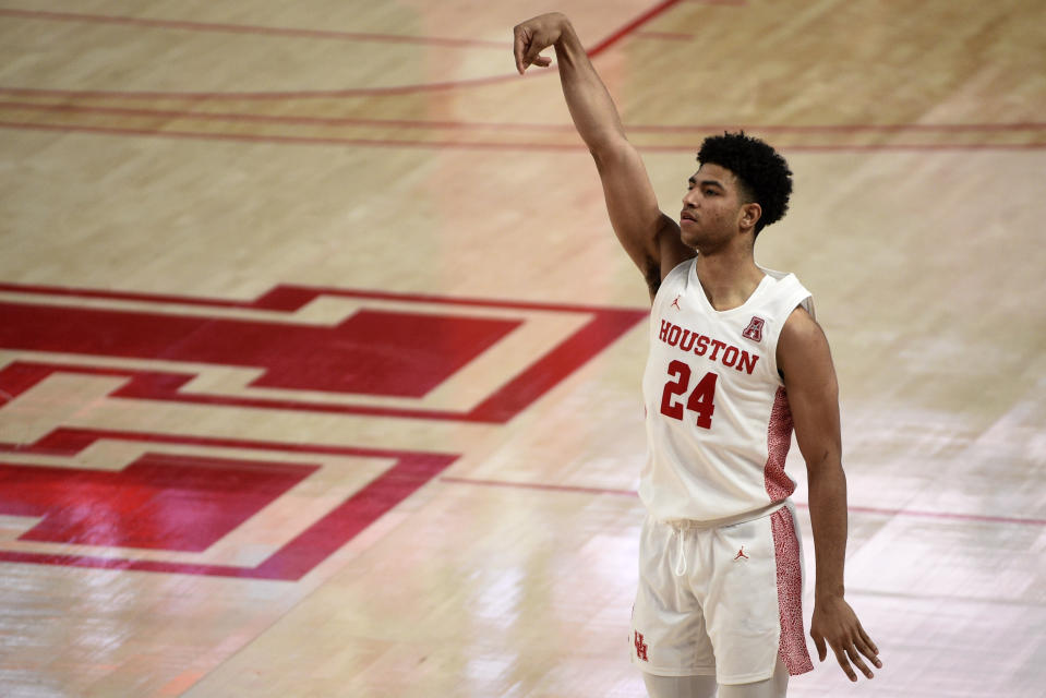 Houston guard Quentin Grimes (24) watches his 3-point basket during the second half of an NCAA college basketball game against Cincinnati, Sunday, Feb. 21, 2021, in Houston. (AP Photo/Eric Christian Smith)