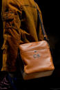 <p>A monogrammed brown shoulder bag from the Bottega Veneta FW18 show. (Photo: Getty Images) </p>