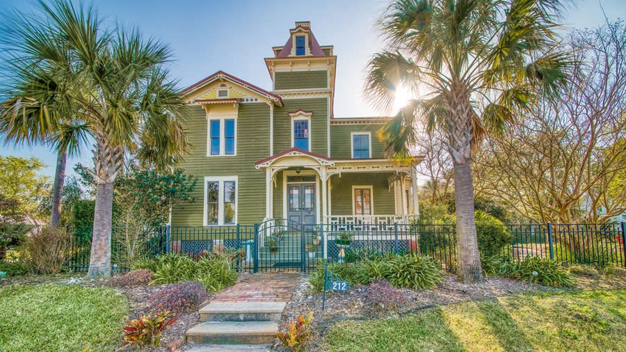 Behold: the rare opportunity to own a piece of Hollywood history tucked away in one of the most beautiful corners of the South. Nineties kids and their parents will likely recognize the 131-year-old Captain's House in Old Town Fernandina Beach, Florida, as Villa Villekulla, the fictional home of Pippi Longstocking in the 1987 movie The New Adventures of Pippi Longstocking. Today, we can see why the one-of-a-kind residence is one of Fernandina Beach's most photographed homes. And it’s currently on the market for $750,000. This 2,220-square-foot home has so much more to offer than its claim to fame as the on-screen residence of everyone’s favorite “freckle-faced redhaired girl.” Sure, it needs a little work, but its quirky architecture, original details, and magnificent views of the Amelia River are worth a little elbow grease. And even don’t get us started on all the stained glass!