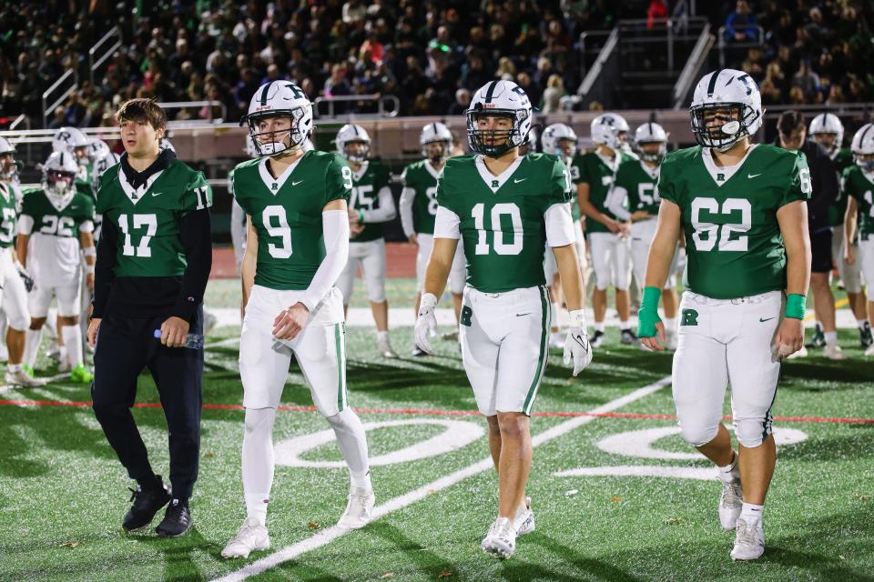 Ramapo's team captains take the field for the opening coin toss.