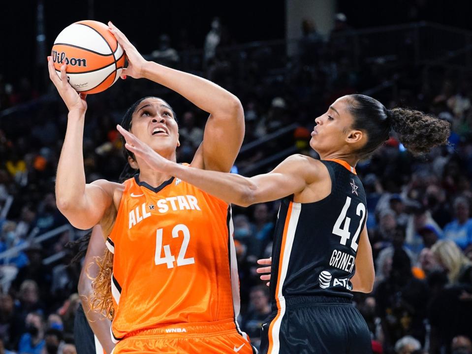 Team Wilson's Brionna Jones (left) shoots against Team Stewart's Skylar Diggins-Smith as both players wear Brittney Griner's name and number on their WNBA All-Star jerseys.