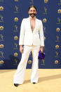 <p>The <em>Queer Eye </em>star stunned on the carpet in a white power suit over a sheer turtleneck. (Photo: Getty Images) </p>