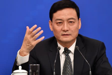 FILE PHOTO: Xiao Yaqing, chairman of the State-owned Assets Supervision and Administration Commission (SASAC) attends a news conference in Beijing