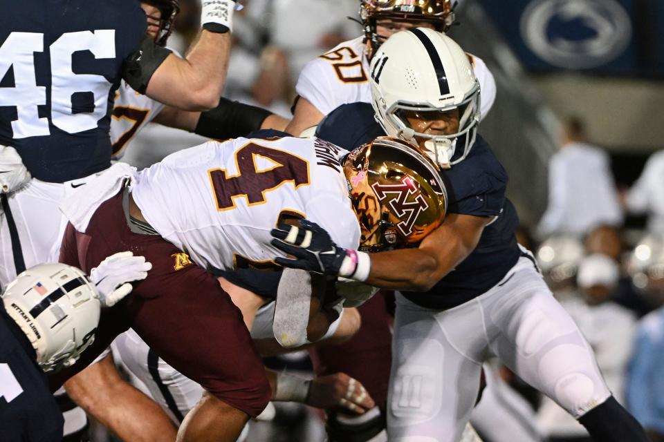 Penn State linebacker Abdul Carter (11) tackles Minnesota running back Mohamed Ibrahim (24) during the first half of an NCAA college football game Saturday, Oct. 22, 2022, in State College, Pa. (AP Photo/Barry Reeger)