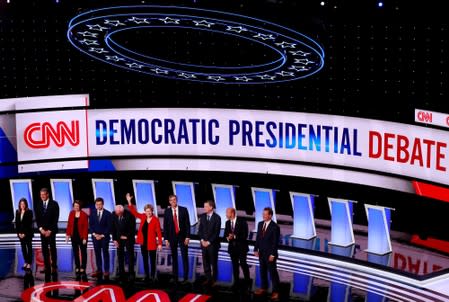 FILE PHOTO: The candidates stand on stage on the first night of the second 2020 Democratic U.S. presidential debate in Detroit