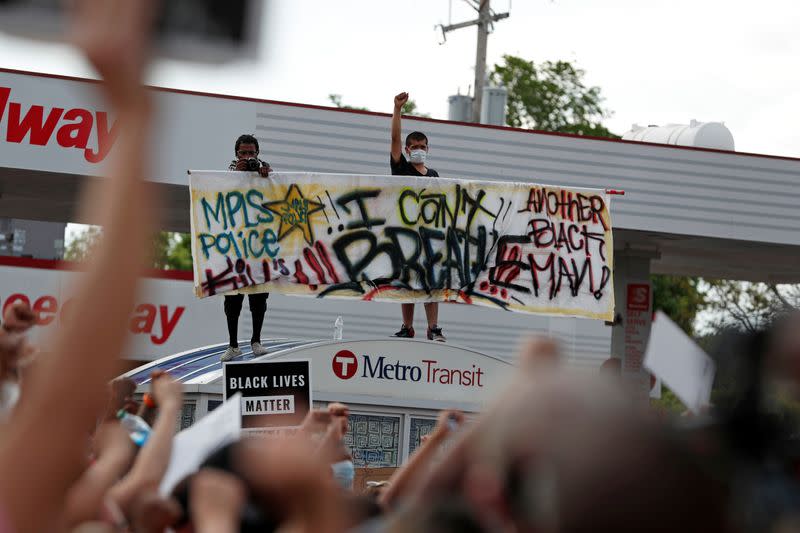 Protesters gather at the scene where Floyd was pinned down by a police officer in Minneapolis