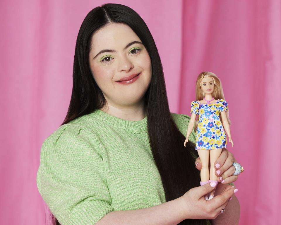 British model Ellie Goldstein poses with Barbie's first doll with Down's syndrome, the newest addition to the Fashionistas line