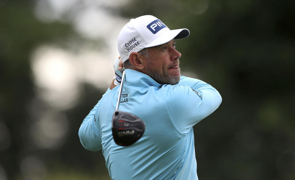 England's Lee Westwood tees off the 5th during day one of the British Masters at Close House Golf Club, near Newcastle, England, Wednesday July 22, 2020. The European Tour resumes in earnest after its pandemic-induced shutdown with the British Masters starting Wednesday. (Mike Egerton/PA via AP)