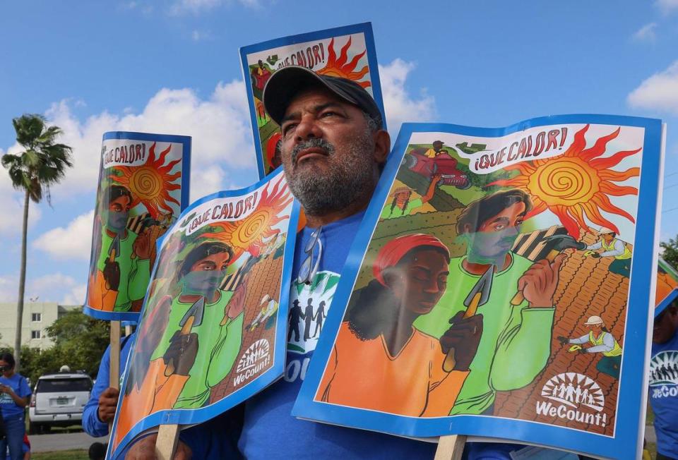 Pedro Trejos, member of We Count!, a membership-led organization of low-wage immigrant workers and families, along with others hold signs of the ¡Que Calor! campaign during the launching of Miami-Dade County’s Extreme Heat Action Plan. On Dec. 14, 2022, Miami-Dade County Mayor Daniella Levine Cava, together with the Miami Foundation, launched Miami-Dade County’s Extreme Heat Action Plan, a blueprint to reduce the health and economic impacts of increasing extreme heat, and create a baseline for further research and new partnerships around this issue at Amelia Earhart Park in Hialeah. Carl Juste/cjuste@miamiherald.com