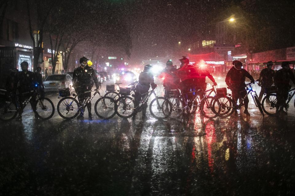 Police secure a scene after arresting protesters broke curfew by marching through Manhattan Wednesday, June 3, 2020, in New York, during a solidarity rally calling for justice over the death of George Floyd. Floyd died after being restrained by Minneapolis police officers on May 25. (AP Photo/Wong Maye-E)