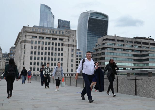 Commuters crossing London Bridge during evening rush hour (Yui Mok/PA)