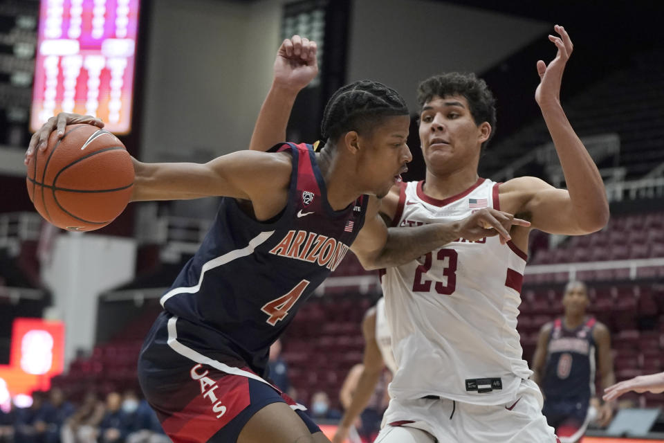 Arizona guard Dalen Terry (4) drives to the basket against Stanford forward Brandon Angel (23) during the first half of an NCAA college basketball game in Stanford, Calif., Thursday, Jan. 20, 2022. (AP Photo/Jeff Chiu)