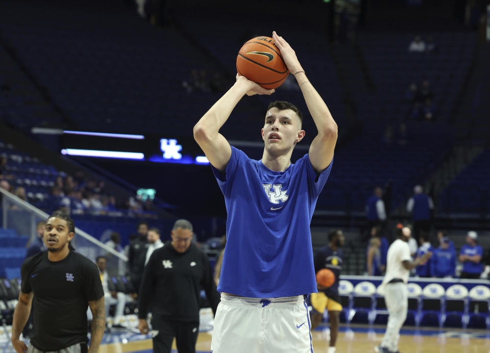 FILE - Kentucky's Zvonimir Ivisic warms up before an NCAA college basketball game against Texas A&M Commerce in Lexington, Ky., Friday, Nov. 10, 2023. Kentucky freshman forward Zvonimir Ivisic says on social media that the NCAA has cleared him to play, ending a prolonged eligibility process that had frustrated Wildcats coach John Calipari along with the fan base, Saturday, Jan. 20, 2024.(AP Photo/James Crisp, File)
