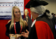 <p>A man in Revolutionary War era attire chats at a booth at the Conservative Political Action Conference (CPAC) at National Harbor, Md., Feb. 22, 2018. (Photo: Kevin Lamarque/Reuters) </p>