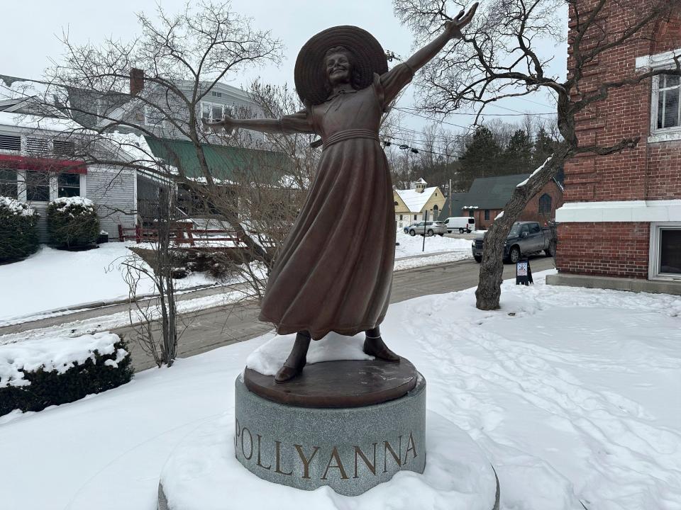 A bronze statue of Pollyanna sits outside the Littleton public library to honor the 1913 book by local author Eleanor H. Porter, whose main character came to define relentless optimism, Jan 22, 2024, in Littleton, N.H. Littleton town manager Jim Gleason, whose late son was gay, resigned effective Friday, Feb. 2, 2024, to take a stand against the anti-LGBTQ sentiments being expressed by some people in Littleton.