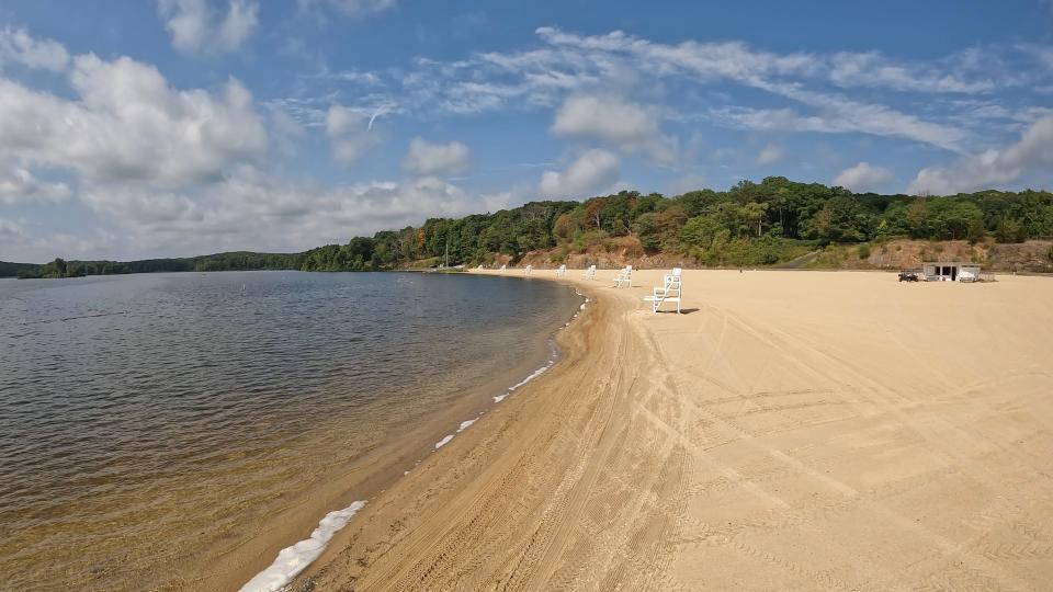 Algae bloom foam gathers on the shoreline of Lake Welch in Harriman State Park Aug. 30, 2022. The lake has be closed because of a harmful algal bloom.