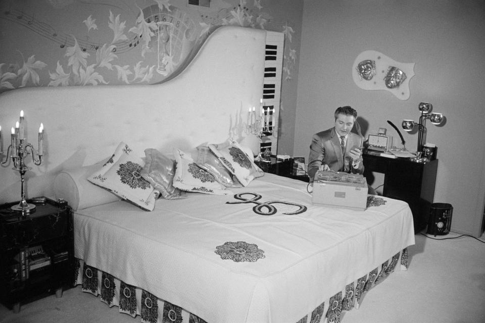 His unique headboard was not the “I’ll Be Seeing You” singer’s only musically-themed decor. In classic over-the-top Liberace fashion, the star’s piano-shaped pool was bordered by a row of black-and-white keys in homage to the instrument that made him an icon.