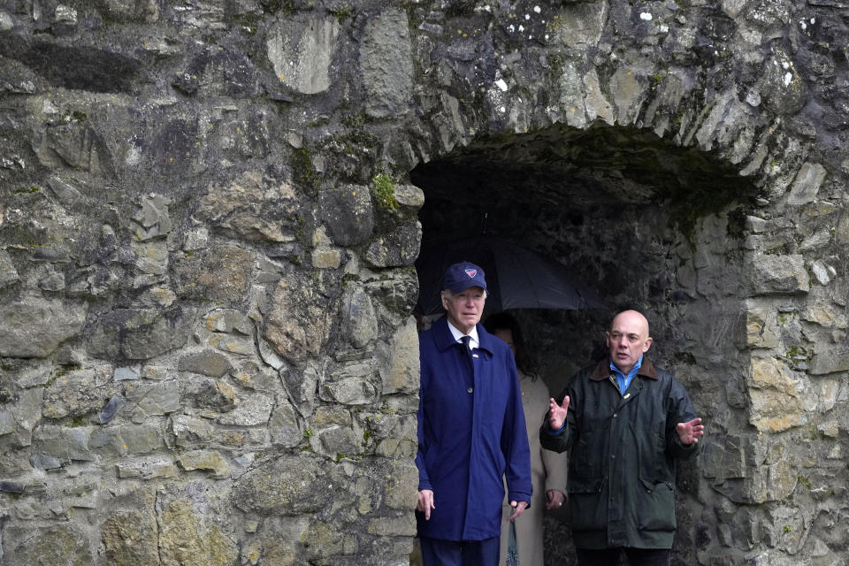 President Joe Biden listens as tour guide Gerry Hoey speaks as Biden tours Carlingford Castle in County Louth, Ireland, Wednesday, April 12, 2023. (AP Photo/Patrick Semansky)