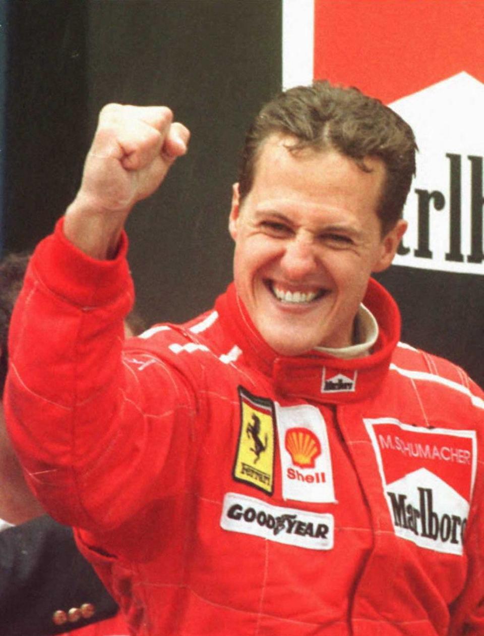 Germany's Michael Schumacher clenches his fist after winning the Spanish Formula One Grand Prix 02 June 1996 on the Cataluna racetrack in Barcelona. AFP PHOTO (Photo by Eric CABANIS / AFP) (Photo by ERIC CABANIS/AFP via Getty Images)