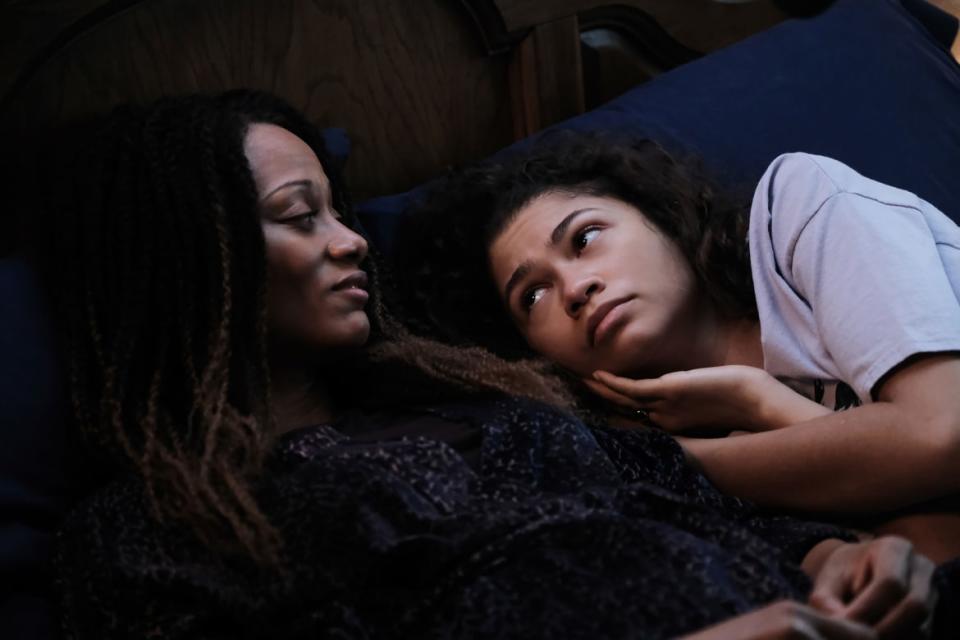 Zendaya lays on Nika King in a still from 'Euphoria'