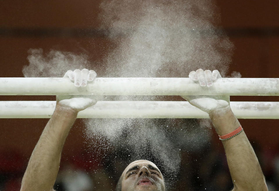 Danell Leyva prepares for parallel bars