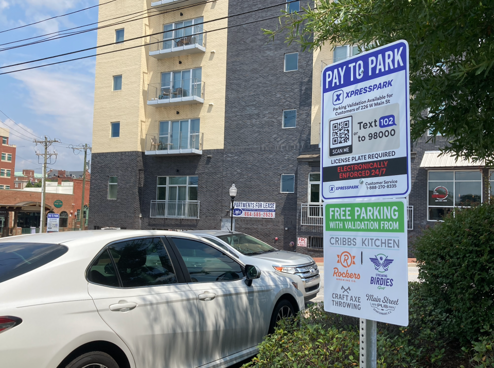 The parking lots at 226 W. Main St. are now pay-to-park.