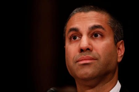 FILE PHOTO: Ajit Pai, Chairman of the Federal Communications Commission, testifies before a Senate Appropriations Financial Services and General Government Subcommittee on Capitol Hill in Washington, U.S., June 20, 2017. REUTERS/Aaron P. Bernstein