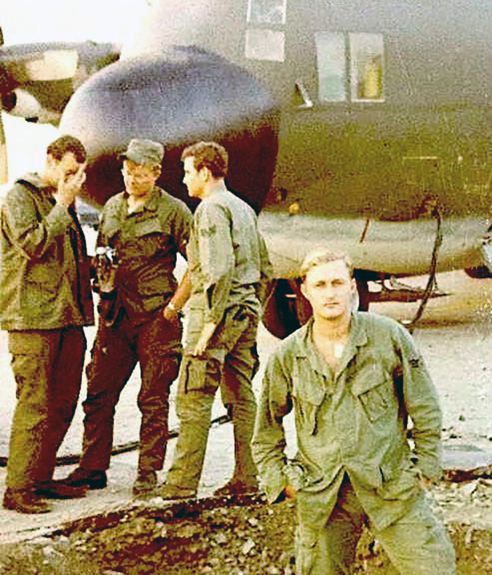 Terry Siravo stands in front of a cargo aircraft at Da Nang Air Base, Vietnam, 1970.