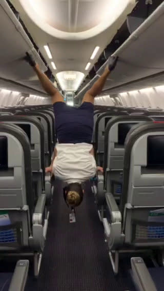 This flight attendant shows off her remarkable acrobatic skills to close the overhead bins with her feet - while wearing high heels. Lindsey O'Brien, 35, gripped onto the armrests before flipping upside down and using her feet to close four luggage containers above. She twirled back down to the aisle and lifted her arms in triumph as her fellow crew members cheered her on. The video was filmed in June aboard an aircraft which had been grounded in her home city of Philadelphia, Pennsylvania, due to Covid-19.