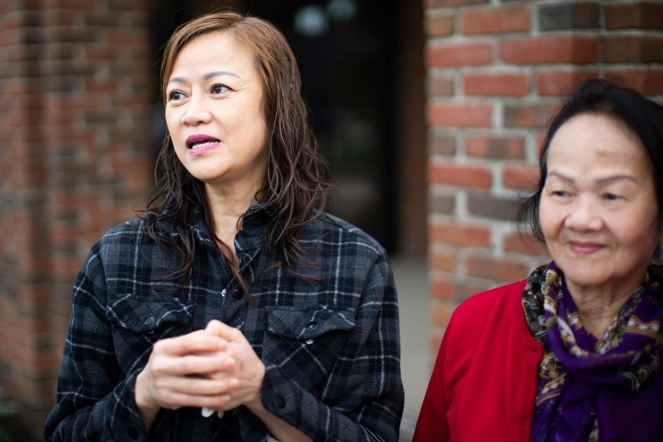 Ha Le, comes out of morning Mass Thursday with her mother, Kham Nguyen, at St. Matthias Church on the Northeast Side, one of 15 parishes slated for closure by the Catholic Diocese of Columbus.