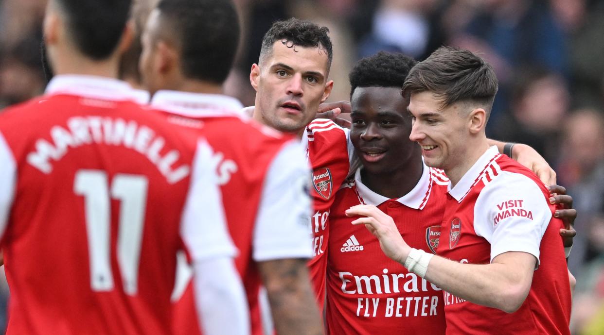  Bukayo Saka of Arsenal celebrates with his teammates after scoring the side's fourth goal during the Premier League match between Arsenal and Crystal Palace at the Emirates Stadium on March 19, 2023 in London, United Kingdom. 