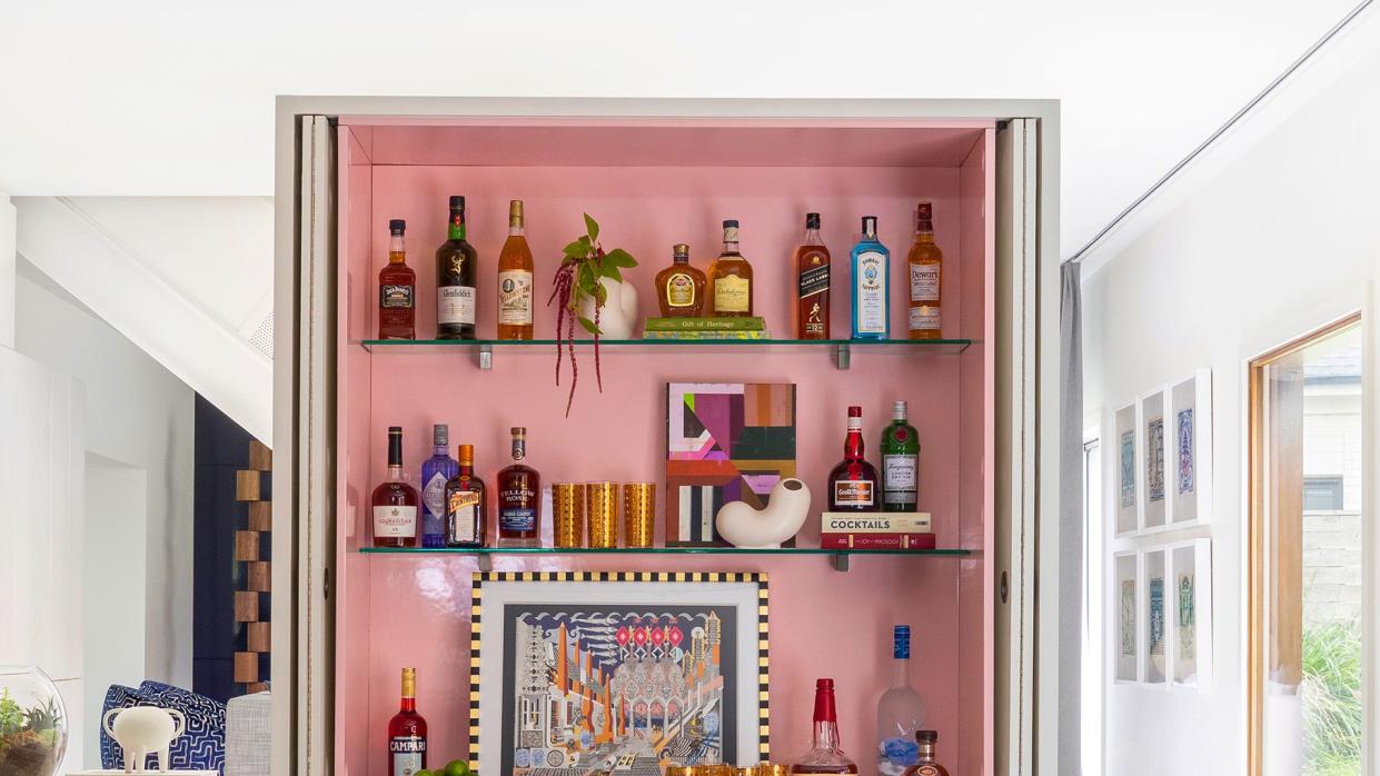 living room with home bar in pink