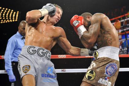 Gennady Golovkin (silver trunks) hits Curtis Stevens during their middleweight title fight. (USA Today)