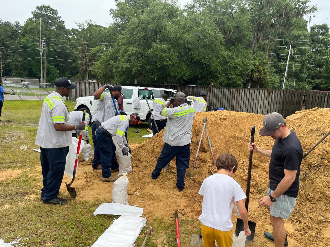 A sandbag filling station on Shanklin Road, set up by Beaufort County, was busy early Monday morning, Aug. 4, 2024, as residents rush to prepare for Debby. By 9 am Public Works employees already had filled 1,000 bags, said Shawn Brodus. As the rain began, Brodus and other Public Works employees shoveled sand into the bags as, then loaded them into car trunks that streamed into the parking lot. “It was real hectic this morning. As fast as we’re filling them, they’re getting them.”