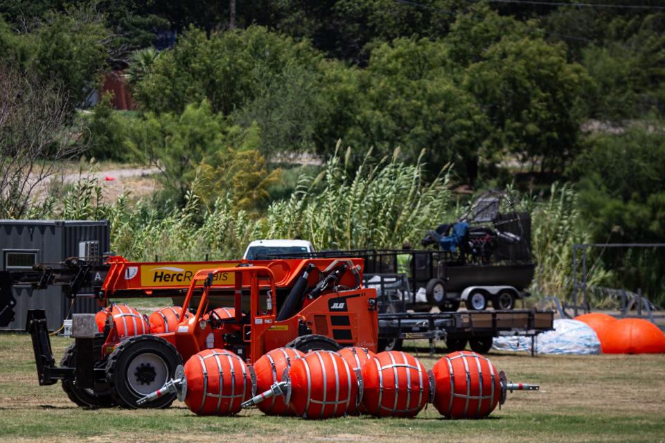 Buoys used in the Rio Grande to stop unauthorized border crossings sit in a staging area along the river on Saturday, July 16, 2023, in Eagle Pass, Texas.