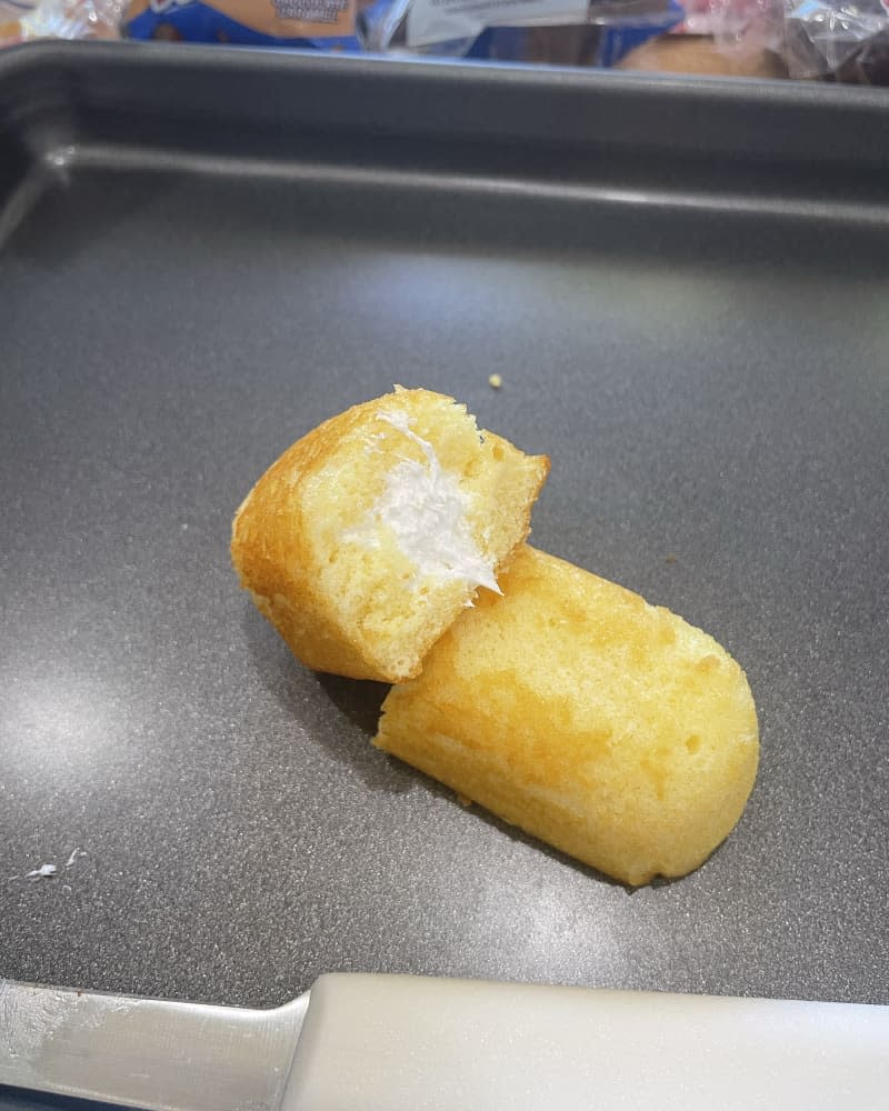 Twinkie Hostess snack cut open on baking sheet
