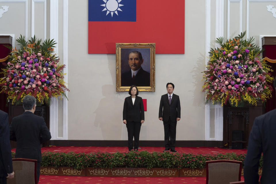 In this photo released by the Taiwan Presidential Office, Taiwanese President Tsai Ing-wen, center stands with Vice-President Lai Ching-te during an inauguration ceremony at the Presidential office in Taipei, Taiwan, Wednesday, May 20, 2020. Tsai was inaugurated for a second term amid increasing pressure from China on the self-governing island democracy it claims as its own territory. (Taiwan Presidential Office via AP)