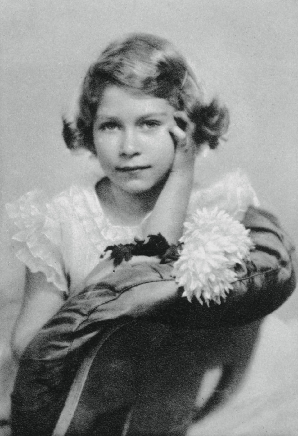 Princess Elizabeth aged nine, 1935, (1937). The future Queen Elizabeth II (1926-). A photograph from the Illustrated London News: Coronation Record Number, (London, 1937). (Photo by The Print Collector/Print Collector/Getty Images)