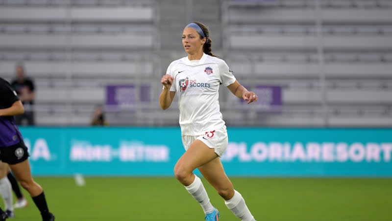 Washington Spirit forward Ashley Hatch (33) follows a ball during an NWSL Challenge Cup soccer match against the Orlando Pride, Saturday, March 19, 2022, in Orlando, Fla.