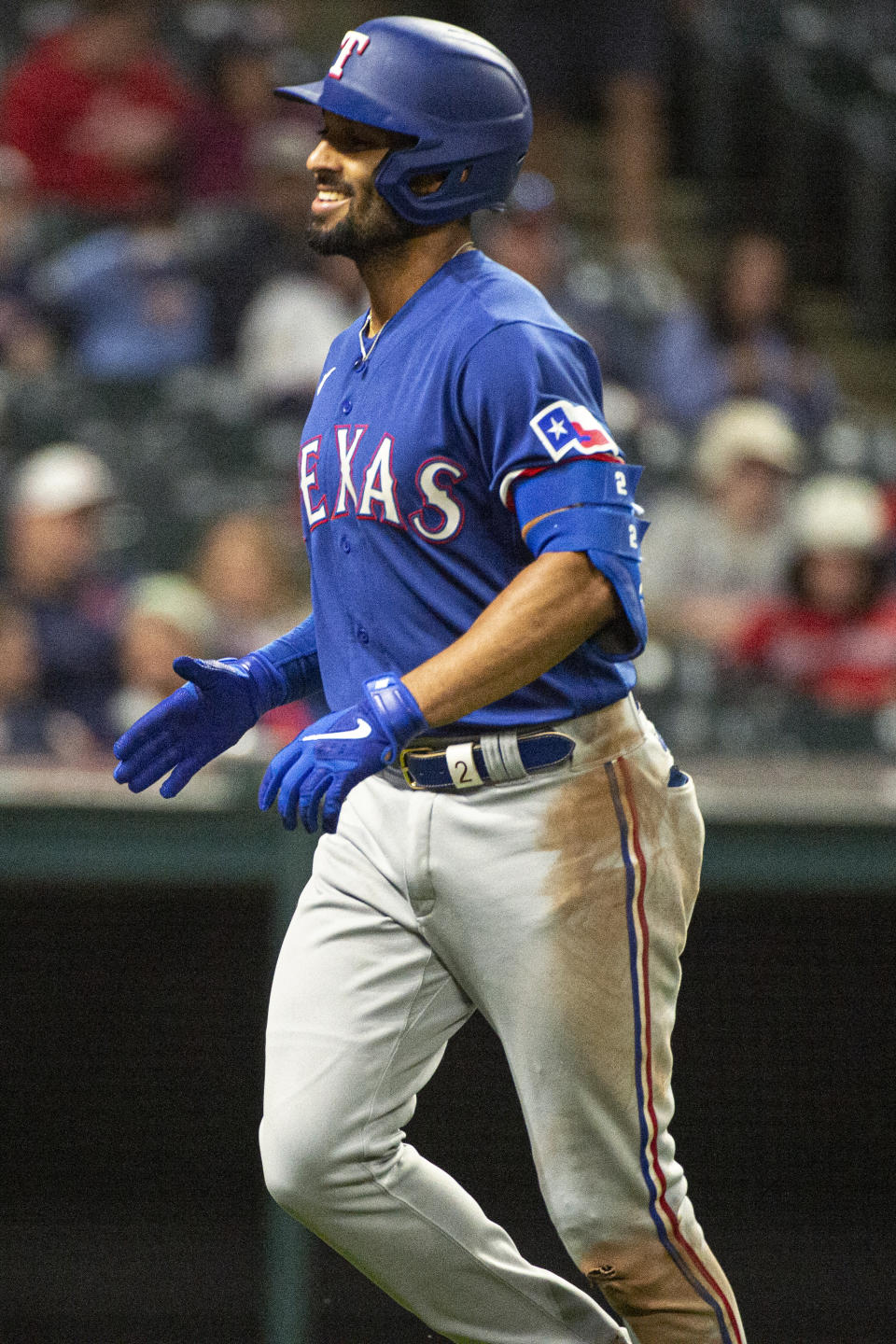 Texas Rangers' Marcus Semien smiles after hitting a solo home run off Cleveland Guardians relief pitcher Anthony Gose during the eighth inning of the second game of a baseball doubleheader in Cleveland, Tuesday, June 7, 2022. It was the second home run of the game for Semien and third of the day. (AP Photo/Phil Long)