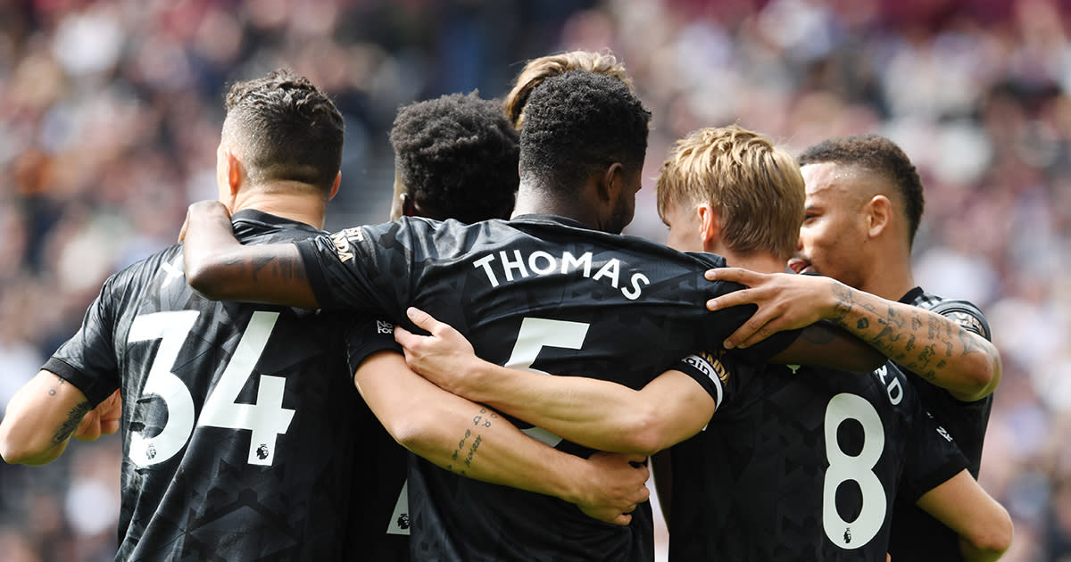  Arsenal captain Martin Odegaard celebrates with teammates after scoring the team's second goal during the Premier League match between West Ham United and Arsenal FC at London Stadium on April 16, 2023 in London, England. (Photo by  