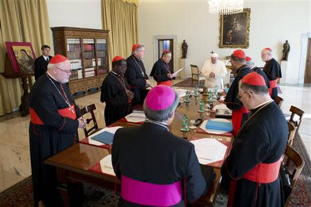 Pope Francis attends a meeting with cardinals at the Vatican October 1, 2013. REUTERS/Osservatore Romano