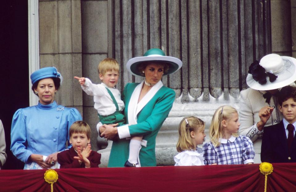 london, england june 11 l r princess margaret, countess of snowdon, prince william, diana, princess of wales, wearing a green dress with a white collar and matching hat designed by philip somerville and holding prince harry, lady rose windsor, lady davina windsor, princess michael of kent and lord frederick windsor stand on the balcony of buckingham palace following the trooping the colour ceremony on june 11, 1988 in london, england photo by anwar husseinwireimage