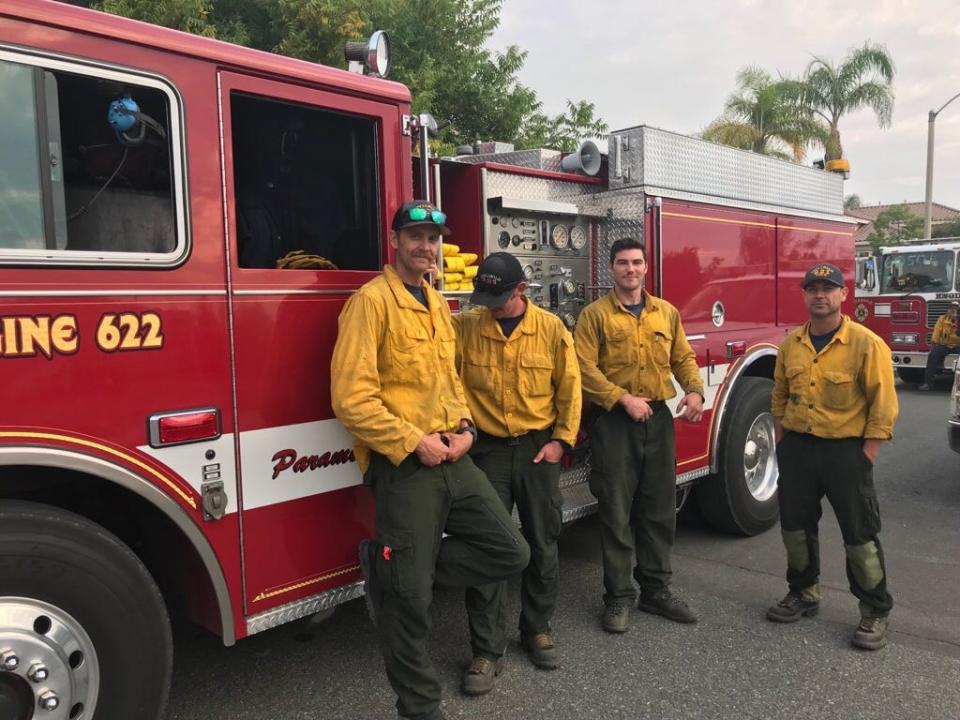 Part of a five-man crew from Idyllwild, California, rests for coffee at 7:30 am Thursday, Sept. 5, 2019, after spending all night building fuel breaks and cutting lines as part of the support strike team 6050A. They built a fuel break behind Copper Canyon together with Cal Fire crews partially staffed by prisoners.