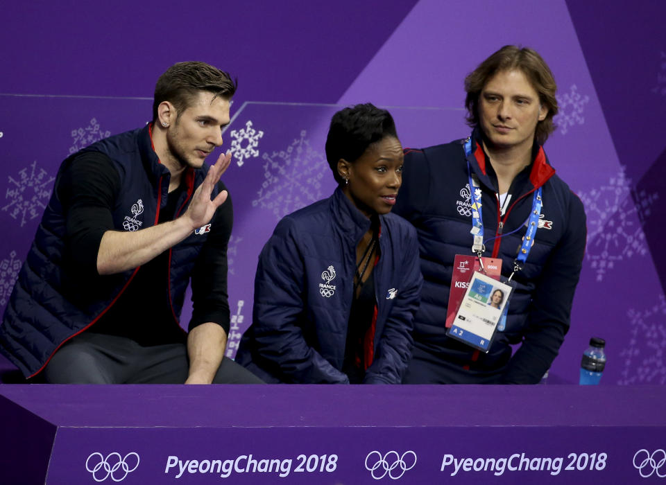 Vanessa James and Morgan Cipres of France with their coach John Zimmerman at the 2018 Olympics