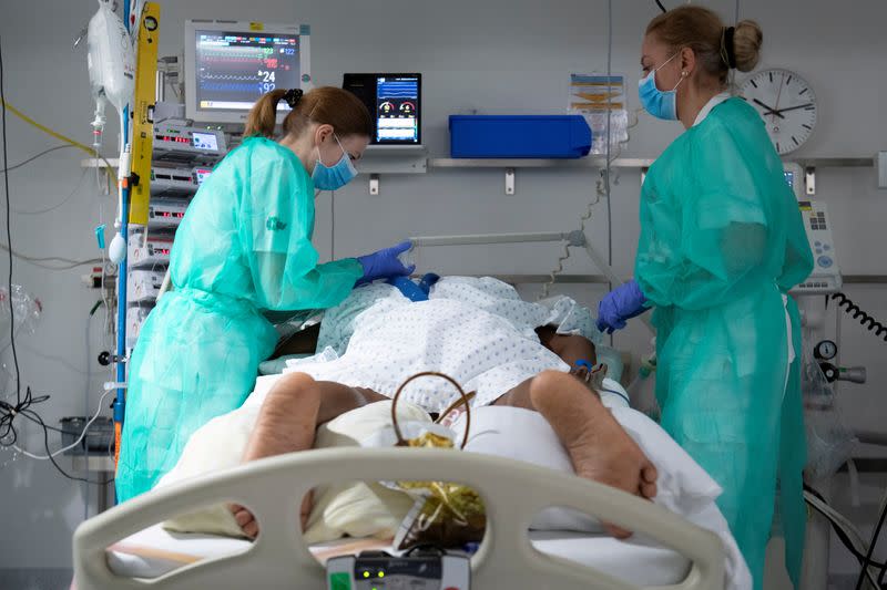 FILE PHOTO: Staff treat a patient in the intensive care unit at the CHUV in Lausanne