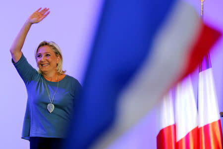 French National Front (FN) political party leader Marine Le Pen waves at supporters during a FN political rally in Frejus, France September 18, 2016. REUTERS/Jean-Paul Pelissier